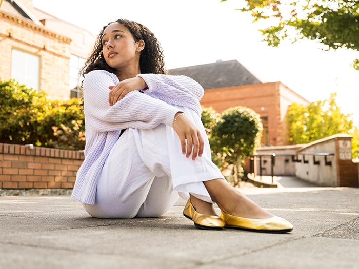 Woman wearing Shiny Gold Ballerines