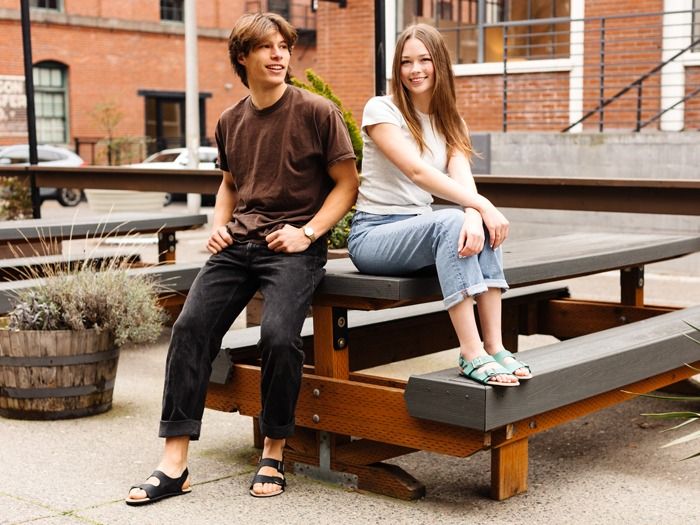 Man and woman wearing Black and Beach Glass Camino Lite Sandals