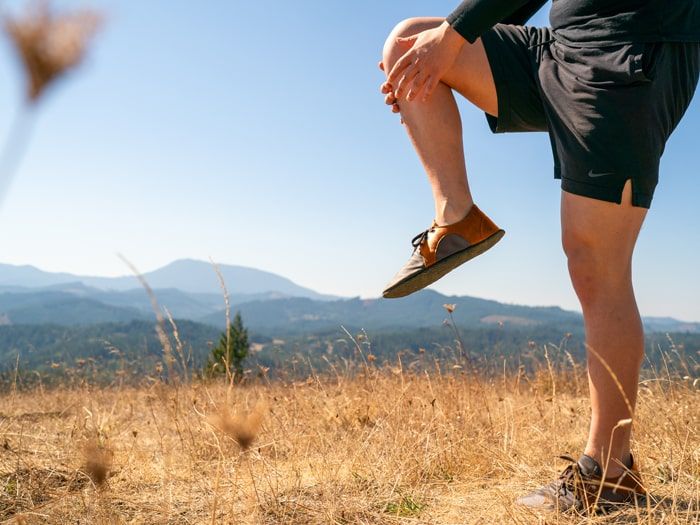 Brown leather running shoe on mountain