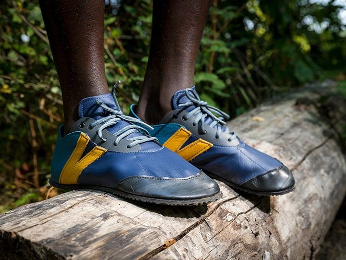 Blue and yellow barefoot running shoes