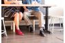 chukka boots being worn by a man and a woman at a coffee shop