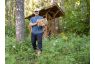 Man in phoenix boots carrying firewood