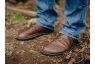 Brown leather rogue shoes outdoors
