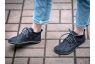 black wide toe box casual shoes worn by a woman on a college campus