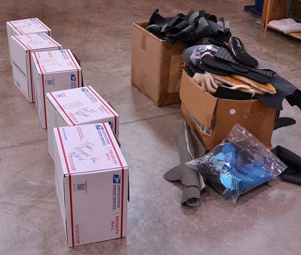 Five team boxes and bins of material