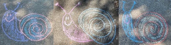 Three snails drawn with sidewalk chalk